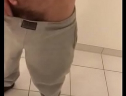 Latin boy stripping and playing with cock in bathroom