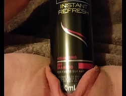 Young slut fucks gaping pussy with 6.3"_ round hairspray can